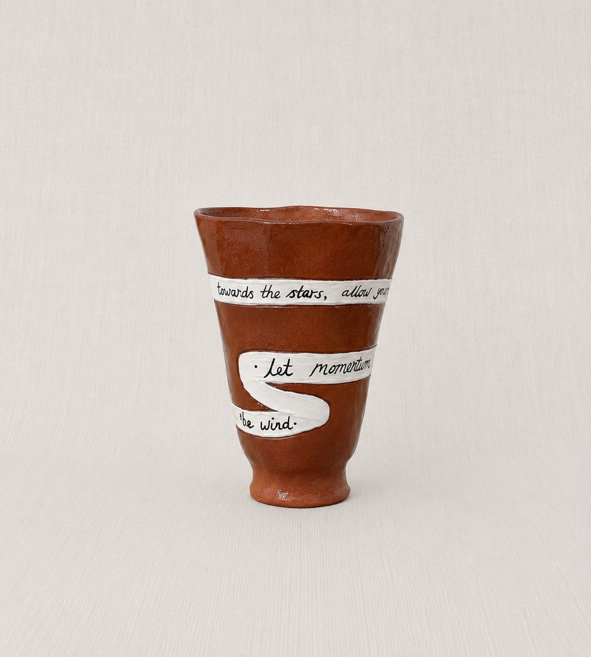 Close-up of the handwritten poem wrapped around the handmade ceramic ritual vessel