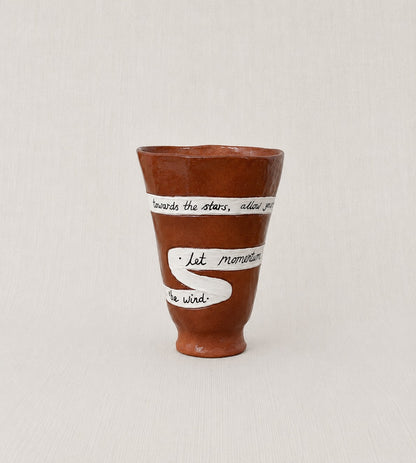 Close-up of the handwritten poem wrapped around the handmade ceramic ritual vessel